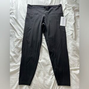 Athleta Stash Pocket Salutation Tight